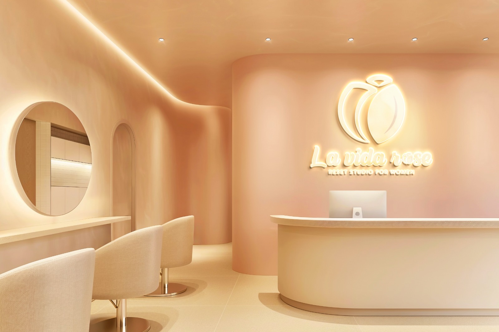 Warm peach reception lounge with cream chairs